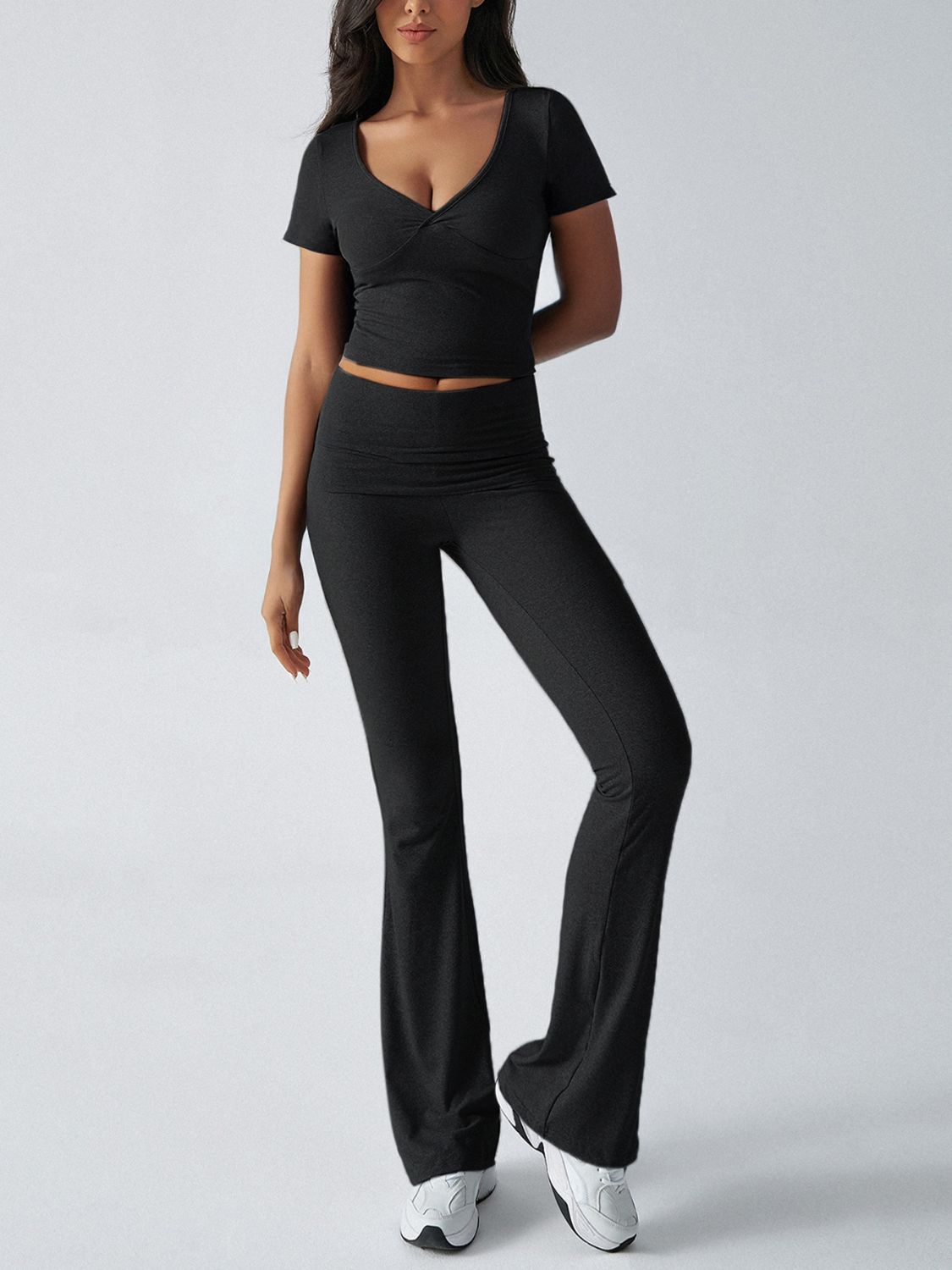 Black ruched waistband flared lounge pants and matching v-neck crop top.