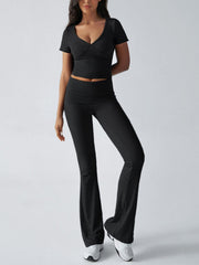 Black ruched waistband flared lounge pants and matching v-neck crop top.