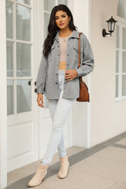 Textured grey overshirt with patch pockets and a subtle chevron pattern.