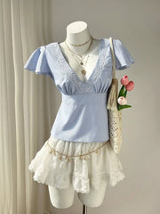 Blue striped polyester blouse with lace V-neck and flutter sleeves.