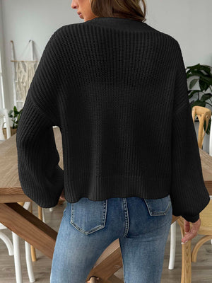 Black balloon sleeve button-down knit cardigan with textured knit.