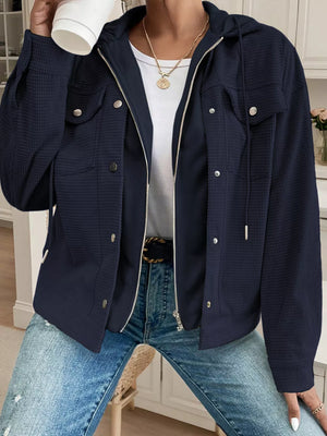 Dark navy waffle knit hooded jacket with buttoned pockets and drawstring details.
