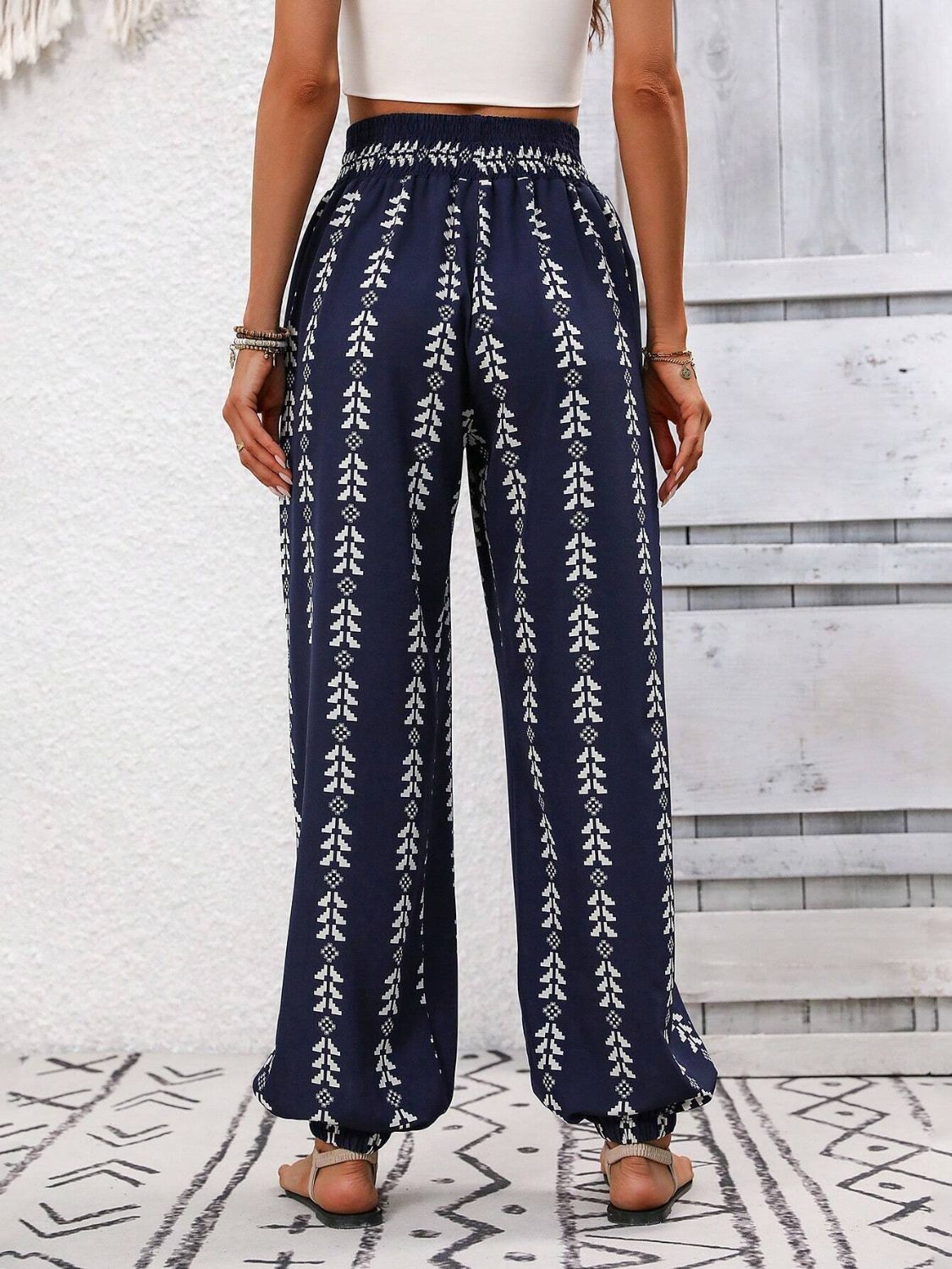 Indigo leaf print gathered ankle trousers with elasticated waist and cuffs.