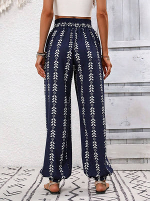 Indigo leaf print gathered ankle trousers with elasticated waist and cuffs.