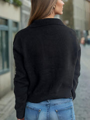 Black acrylic knit cardigan with pearl embellished snowflake detail on sleeve