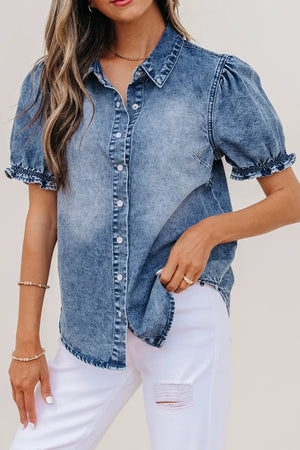 Denim shirt with puff sleeves and frilled cuffs, snap closure, collared neckline.