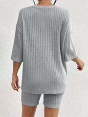 Light gray ribbed lounge set with oversized short-sleeve top and biker shorts.