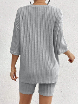 Light gray ribbed lounge set with oversized short-sleeve top and biker shorts.