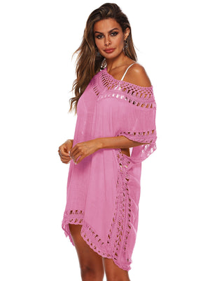 Pink kaftan cover-up with crochet trim and off-the-shoulder neckline.