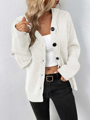 White knit hooded cardigan with button front and black buttons.