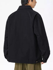 Men's black casual zip-up jacket with collar and button detail