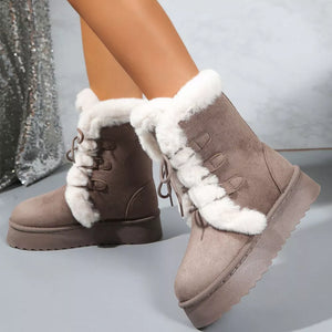 Brown suede lace-up platform ankle boots with white faux fur trim and lining.
