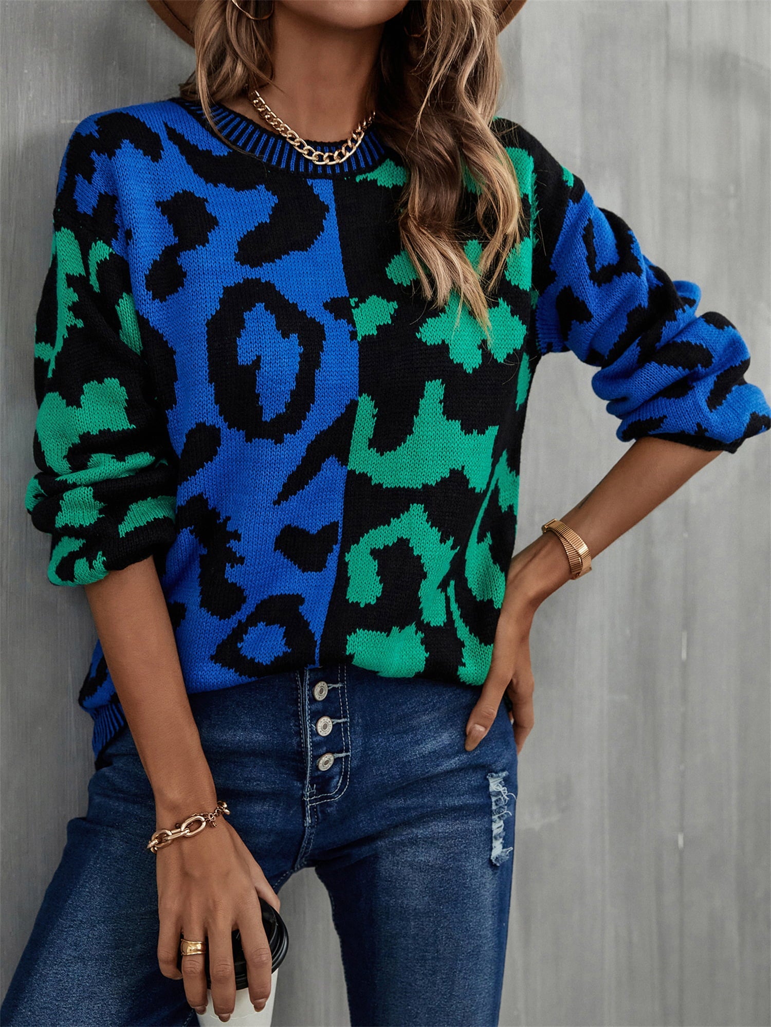 Split leopard knit sweater in blue/green with statement sleeves and crew neck.