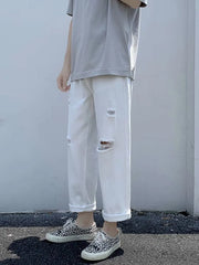 White distressed relaxed fit men's jeans with cuffed hem