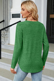 Green marled long sleeve sweater with rounded hem and side button detail.