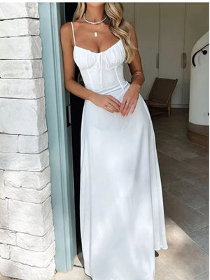White tie-front maxi dress with spaghetti straps and ruched bodice detail.