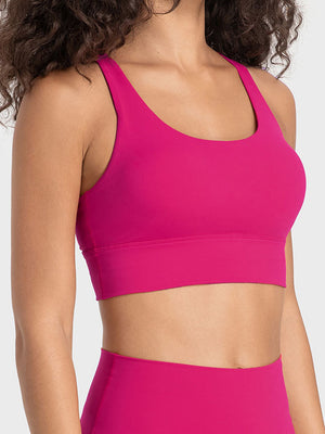 Hot pink performance bra with scoop neck and crisscross back detail