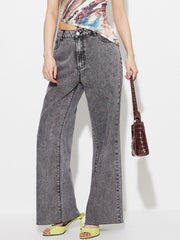 Acid wash flare jeans in dark gray with a high-rise fit and buttoned closure.