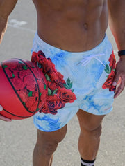 Mesh athletic shorts in pastel blue with a tie-dye print and red rose pattern.