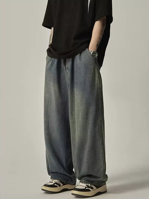 Relaxed fit blue vintage wash drawstring jeans with a wide leg