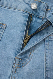 Light wash denim shorts with patch pockets and a zipper fly detail.