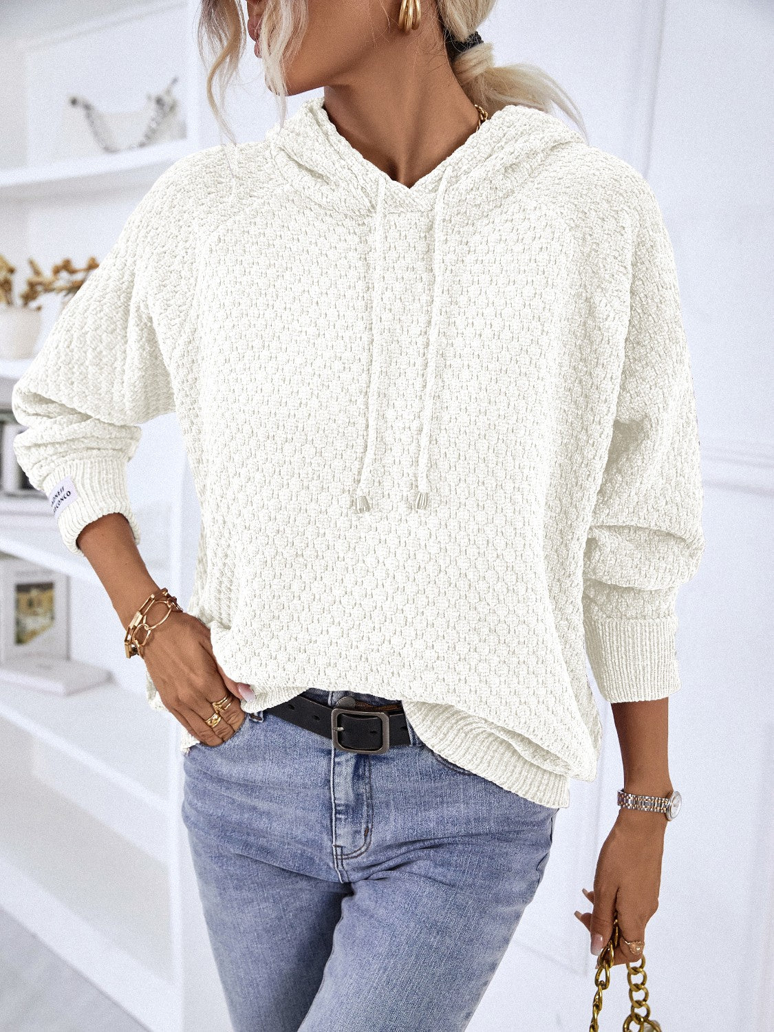 White textured knit raglan sleeve hoodie with drawstring hood and cuffed sleeves.