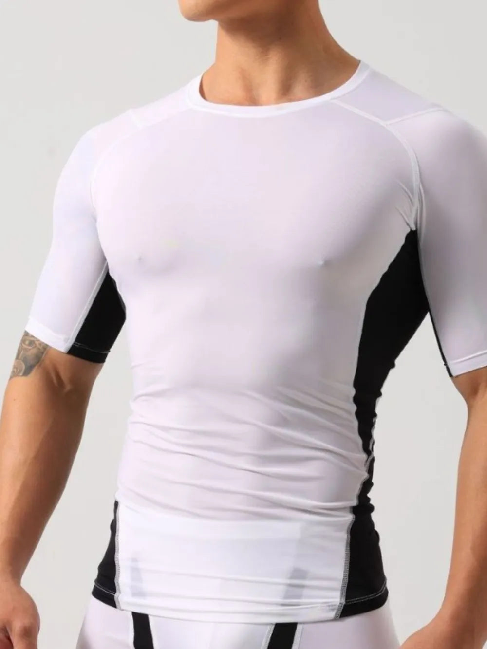 White performance t-shirt with black side panels and short sleeves.