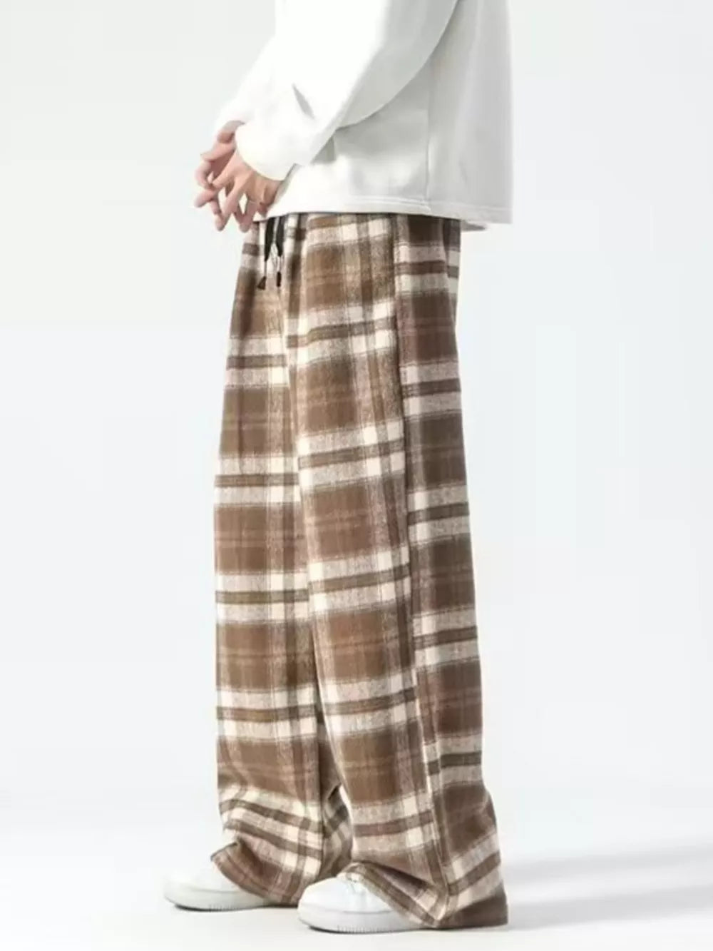 Brown plaid wide-leg sweatpants with drawstring waist and cream accents.