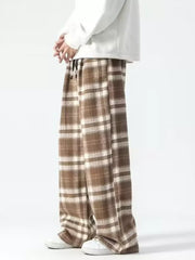 Brown plaid wide-leg sweatpants with drawstring waist and cream accents.