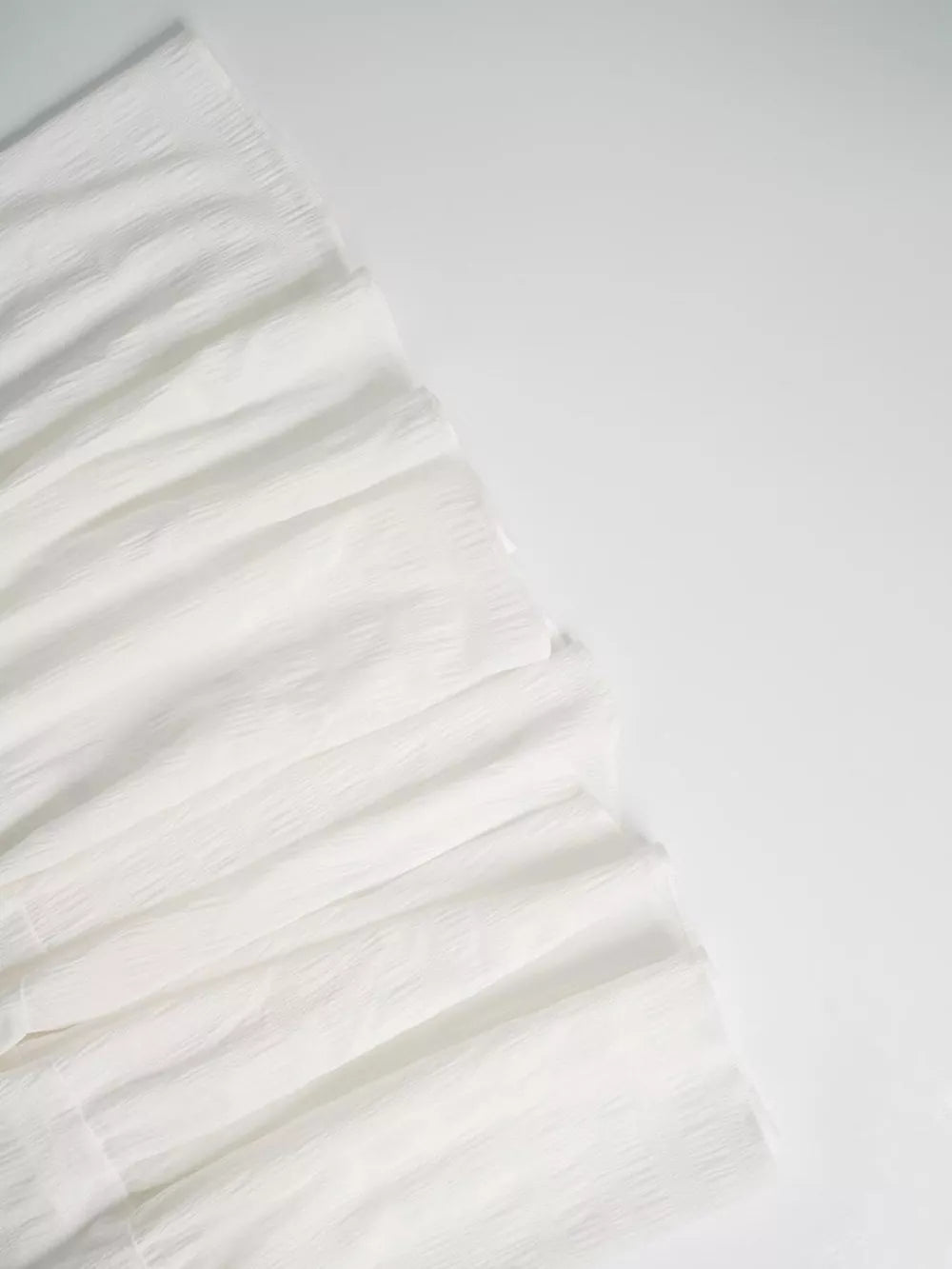 White crinkled tiered maxi skirt with smocked detail