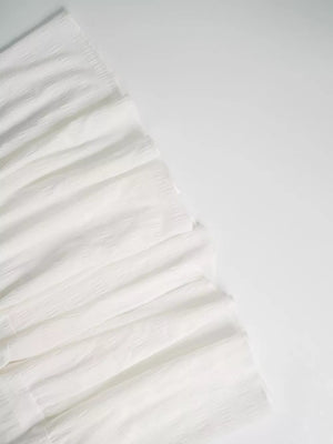 White crinkled tiered maxi skirt with smocked detail