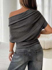 Dark gray ruched off-shoulder knit t-shirt with draped neckline.