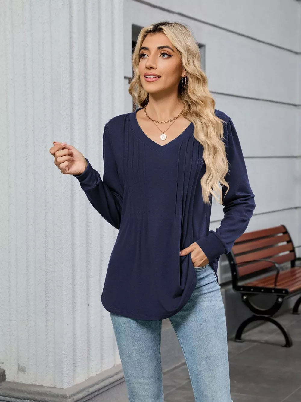 Navy blue V-neck long sleeve maternity t-shirt with pleated detail on the front.