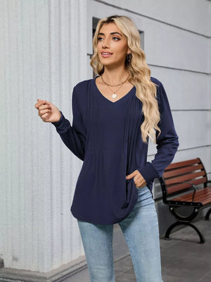 Navy blue V-neck long sleeve maternity t-shirt with pleated detail on the front.