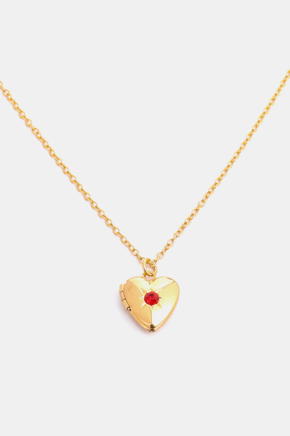 Gold heart locket necklace with red gemstone and 14k gold chain