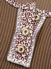 Taupe waffle knit henley top with leopard print placket and wood buttons.