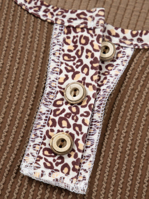 Taupe waffle knit henley top with leopard print placket and wood buttons.