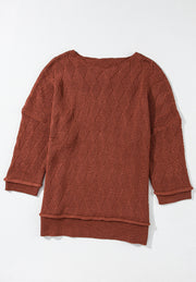 Rust diamond knit relaxed fit sweater with crew neck and cuffed sleeves.