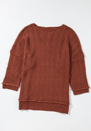 Rust diamond knit relaxed fit sweater with crew neck and cuffed sleeves.