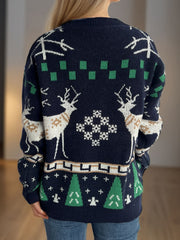Indigo knit sweater with reindeer, snowflake, and Christmas tree motif.