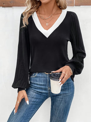 Black ribbed sleeve top with white V-neck contrast collar and balloon sleeves.