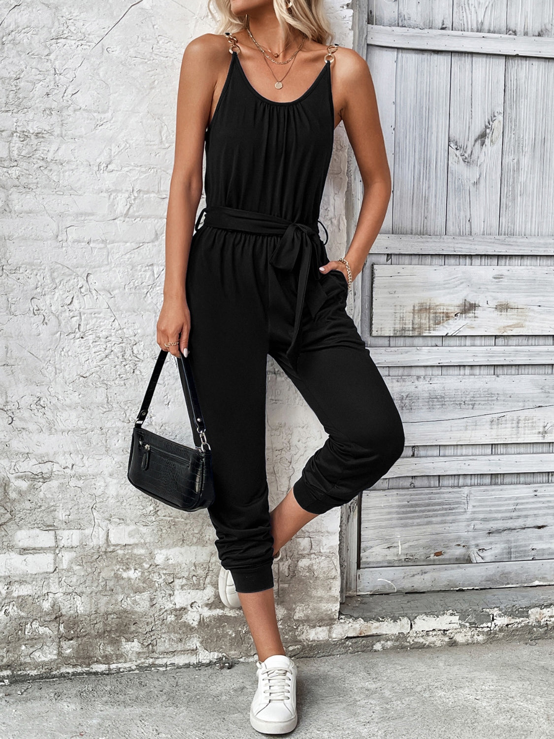Black chain-strap gathered waist jumpsuit with tie belt and cuffed ankles