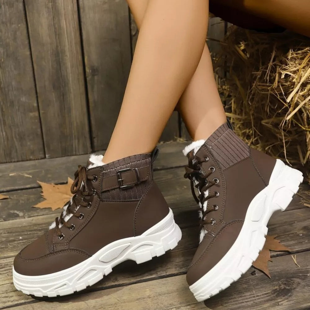 Chocolate lace-up boots with plush accents and knit cuffs.