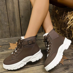 Chocolate lace-up boots with plush accents and knit cuffs.