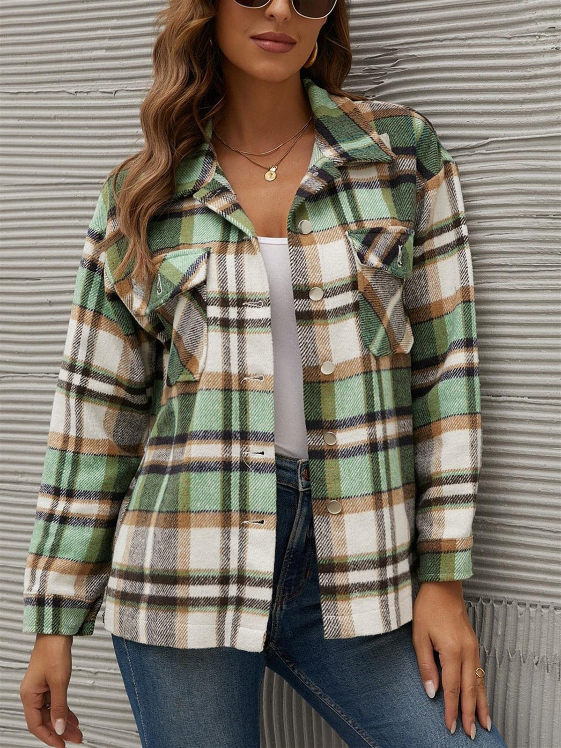 Green plaid collared long sleeve jacket with button front and chest pockets