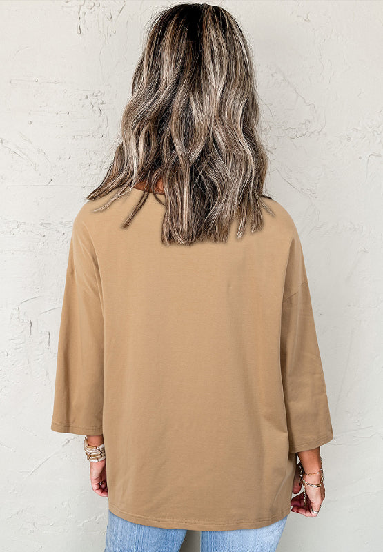 Tan cotton t-shirt with 3/4 sleeves and a relaxed fit.