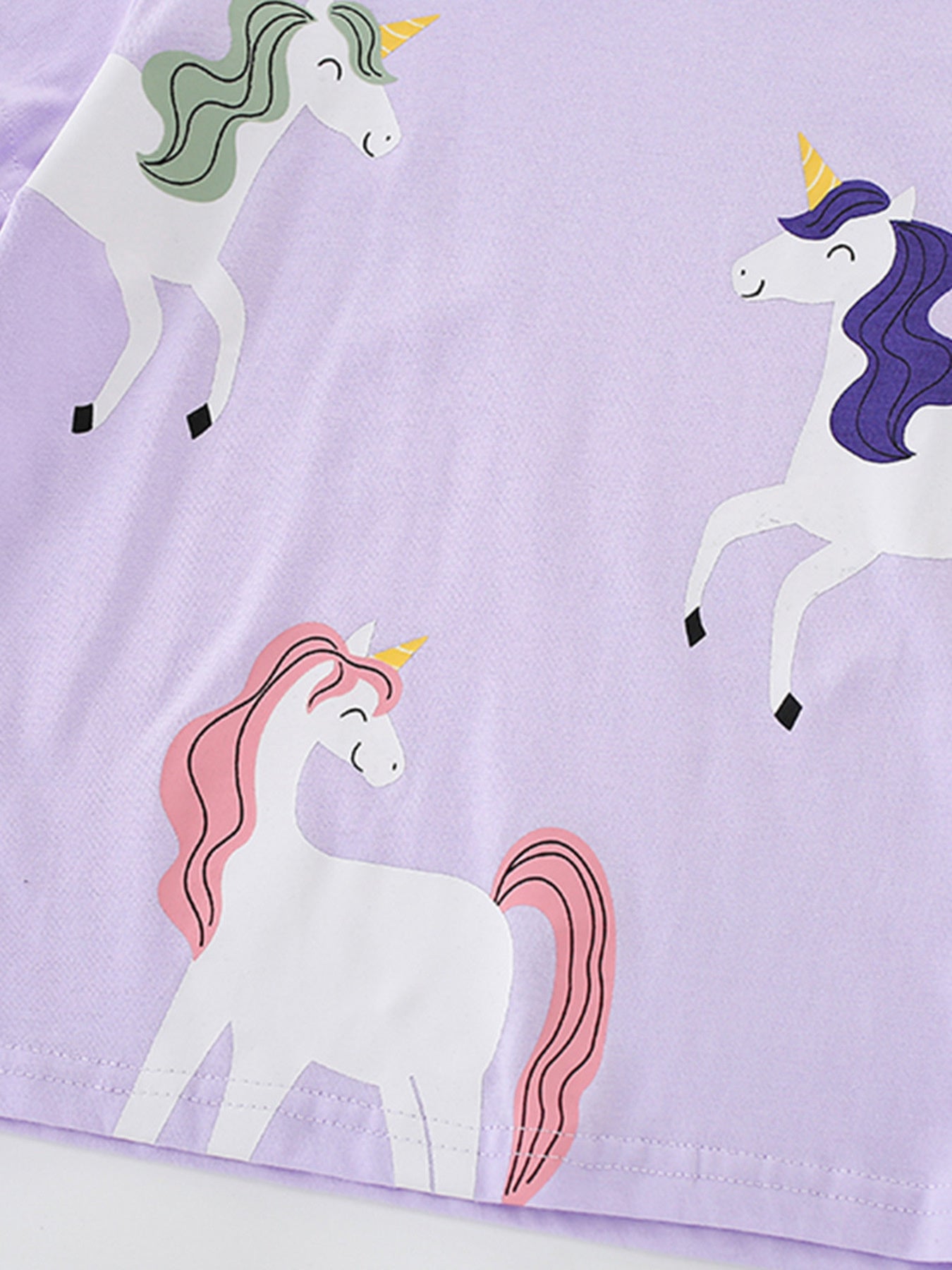 Toddler purple cotton t-shirt with a whimsical unicorn graphic print.
