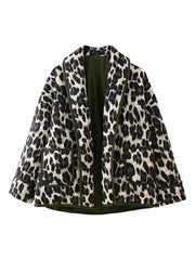 Leopard quilted kimono jacket with pockets and green trim, open front.