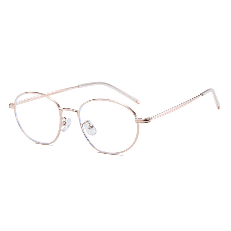 Vintage-inspired round frame eyeglasses in rose gold metal with clear lenses.