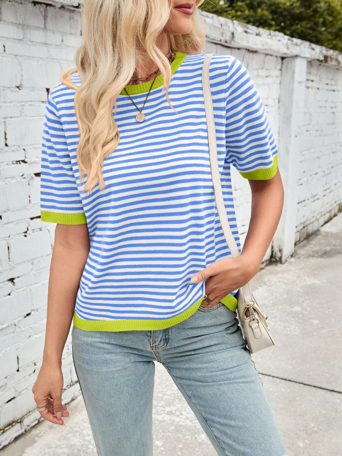 Striped knit tee with blue and white horizontal stripes and neon green trim.